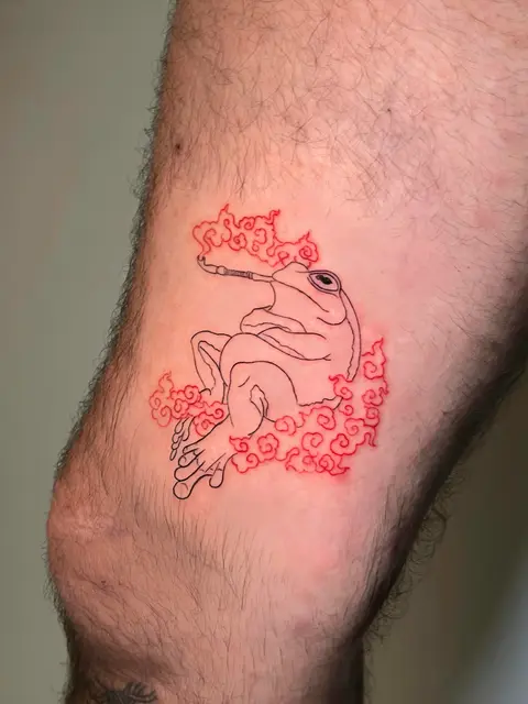 Tatuaggio: rana con nuvole rosse in linea, di Sara - White Garden Tattoo, Roma Colli Aniene
